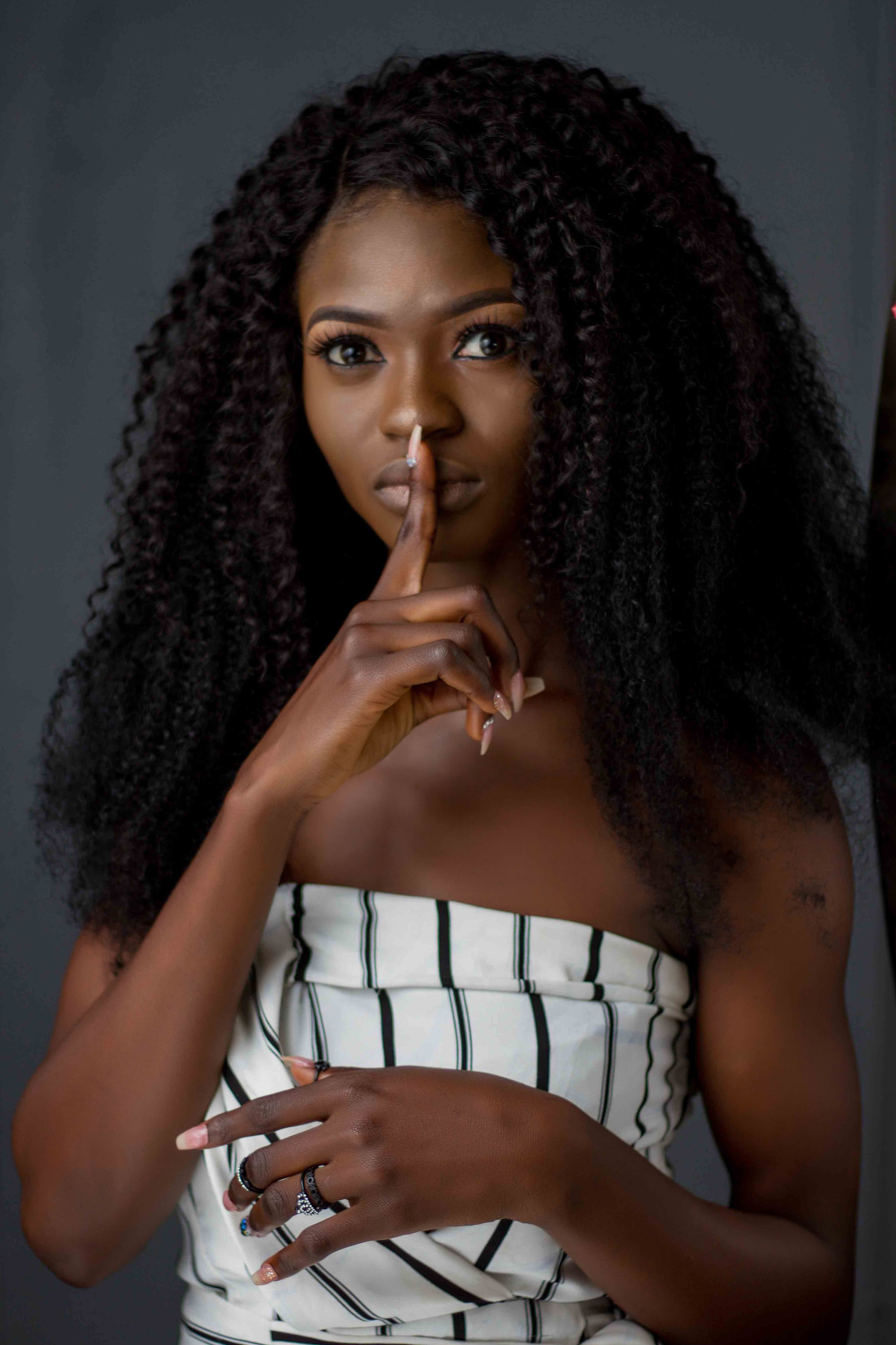 photo-of-woman-putting-her-finger-on-her-lips-1759406